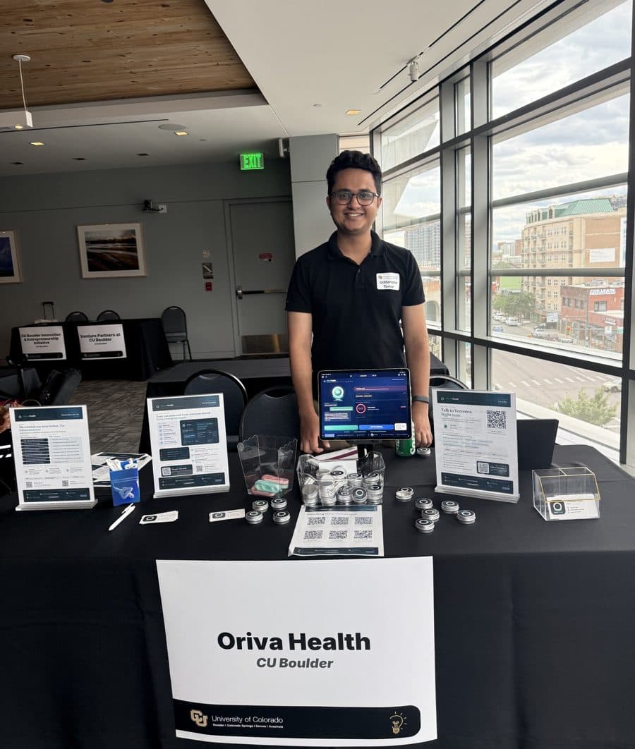 Uditanshu Tomar at the Oriva Health booth with the live demo on an iPad